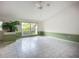 Sun-filled living room with tile floors, large window, and neutral paint creating a relaxing atmosphere at 8822 Misty Creek Dr, Sarasota, FL 34241