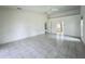 Bright living room featuring tile floors and doorway to kitchen, with an open and airy feel at 8822 Misty Creek Dr, Sarasota, FL 34241