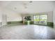 Open-concept living area featuring tile floors, neutral walls, and ample space for entertaining at 8822 Misty Creek Dr, Sarasota, FL 34241