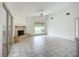 Bright living room features a fireplace, tile floors, and expansive windows for ample natural light and a cozy atmosphere at 8822 Misty Creek Dr, Sarasota, FL 34241
