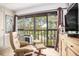 Relaxing balcony view featuring a chair, table, and pond at 9521 86Th Ave # 9521, Seminole, FL 33777