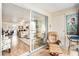 Balcony with a comfortable chair looking into the living room at 9521 86Th Ave # 9521, Seminole, FL 33777