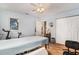 Relaxing bedroom features exercise equipment and light blue walls, with access to an ensuite bathroom at 9521 86Th Ave # 9521, Seminole, FL 33777