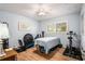 Bedroom features wood floors, light blue walls, and an array of exercise equipment at 9521 86Th Ave # 9521, Seminole, FL 33777