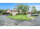 Exterior view with mature trees, landscaped grounds, and covered parking near the residential building at 9521 86Th Ave # 9521, Seminole, FL 33777