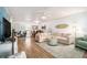 Bright living room featuring wood floors, a ceiling fan, and comfortable seating at 9521 86Th Ave # 9521, Seminole, FL 33777