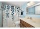 Bathroom with leafy shower curtain at 960 Virginia St # 202, Dunedin, FL 34698