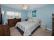 Bedroom with nautical themed art and decor at 960 Virginia St # 202, Dunedin, FL 34698