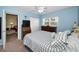 Bedroom featuring natural light and calming blue walls at 960 Virginia St # 202, Dunedin, FL 34698