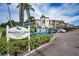 A condo community sign reads 'Heather Lake Condominiums' in front of building and parking at 960 Virginia St # 202, Dunedin, FL 34698