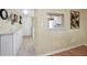Hallway features built-in cabinets and a view into the kitchen through a pass-through window at 960 Virginia St # 202, Dunedin, FL 34698
