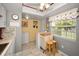 Cozy eat-in kitchen nook with natural light and a functional breakfast bar at 960 Virginia St # 202, Dunedin, FL 34698