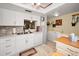 Bright kitchen features white cabinets, stainless steel appliances, and a functional layout at 960 Virginia St # 202, Dunedin, FL 34698