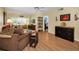 Relaxing living room with comfortable seating, a ceiling fan, and stylish decor at 960 Virginia St # 202, Dunedin, FL 34698