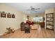 A cozy living room boasts hardwood floors and abundant natural light at 960 Virginia St # 202, Dunedin, FL 34698