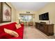 Cozy living room featuring a comfortable seating area and natural light at 960 Virginia St # 202, Dunedin, FL 34698