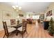 Open-concept living area features wood floors, combined dining and living with abundant natural light at 960 Virginia St # 202, Dunedin, FL 34698