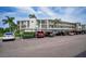Exterior image shows covered parking area and condo building at 960 Virginia St # 202, Dunedin, FL 34698
