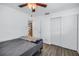 Bedroom featuring neutral colors, laminate wood floors, and closet at 9892 111Th St, Seminole, FL 33772