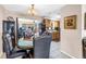 Dining area with wooden table and chairs plus access to the kitchen and living spaces at 9892 111Th St, Seminole, FL 33772