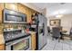 Kitchen featuring stainless steel appliances and a dining area at 9892 111Th St, Seminole, FL 33772