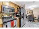 Kitchen featuring stainless steel appliances and a dining area at 9892 111Th St, Seminole, FL 33772