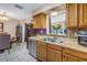 Kitchen featuring stainless steel dishwasher, double sink, and recessed lighting at 9892 111Th St, Seminole, FL 33772