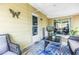 Cozy patio with outdoor seating and a view of the backyard and a glimpse of the interior space at 9892 111Th St, Seminole, FL 33772