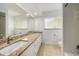 Bright bathroom featuring a large vanity with dual sinks and a shower-tub combination at 115 Lake Shore E Dr, Palm Harbor, FL 34684