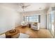 Cozy sitting area with a comfortable chair, accent table and a view of the lake at 115 Lake Shore E Dr, Palm Harbor, FL 34684