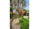 Unique yard art feature creating visual interest in this landscaped backyard setting at 1151 Lancer Ln, Tarpon Springs, FL 34689