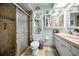 Clean bathroom featuring a glass-enclosed shower, vanity, and decorative accents at 1151 Lancer Ln, Tarpon Springs, FL 34689