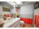 Bathroom with a sink, toilet, and a shower with a curtain at 1151 Lancer Ln, Tarpon Springs, FL 34689