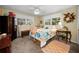 Cozy bedroom with carpet and windows that bring in lots of natural light at 1151 Lancer Ln, Tarpon Springs, FL 34689