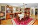 Bright dining room with wooden furniture, chandelier, and elegant decor at 1151 Lancer Ln, Tarpon Springs, FL 34689