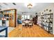 Open floorplan with hardwood floors, cozy seating area, and natural light at 1151 Lancer Ln, Tarpon Springs, FL 34689