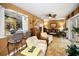 The living room features hardwood floors, a wet bar, comfortable seating, and a decorative deer mount at 1151 Lancer Ln, Tarpon Springs, FL 34689