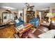 Warm and inviting living room featuring hardwood floors and comfortable furniture at 1151 Lancer Ln, Tarpon Springs, FL 34689