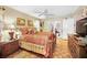 Comfortable main bedroom with a ceiling fan and natural light at 1151 Lancer Ln, Tarpon Springs, FL 34689