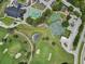 An aerial view captures the recreation options within the community, highlighting the pool, tennis, and basketball courts at 12807 Starling Dr, Odessa, FL 33556