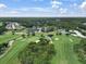 Overhead view of The Eagles Golf Club and Community featuring lush golf courses, ponds and community amenities at 12807 Starling Dr, Odessa, FL 33556