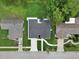An aerial shot displays a well-kept home with a long, bright driveway and lush green lawn at 12807 Starling Dr, Odessa, FL 33556