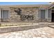 Stone accented clubhouse with black eagle logo at the Eagles Golf Club, offering a stylish and inviting atmosphere at 12807 Starling Dr, Odessa, FL 33556