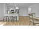 Modern open kitchen featuring stainless steel appliances, granite counters, and a large island with seating at 12807 Starling Dr, Odessa, FL 33556