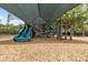 Shaded community playground with slides and climbing structures, designed for hours of fun and safe play for children at 12807 Starling Dr, Odessa, FL 33556