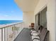 Spacious balcony with seating and ocean views at 13500 Gulf Blvd # 507, Madeira Beach, FL 33708