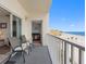 Balcony with chairs and ocean views at 13500 Gulf Blvd # 507, Madeira Beach, FL 33708