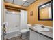 Cozy bathroom featuring a shower-tub combo, tiled floors, and vanity sink at 13500 Gulf Blvd # 507, Madeira Beach, FL 33708