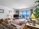 Bright living room with a beachfront view and comfortable seating at 13500 Gulf Blvd # 507, Madeira Beach, FL 33708