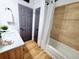 Modern bathroom featuring updated vanity, lighting, and new tub and shower at 1373 Fairfax Rd, Clearwater, FL 33764